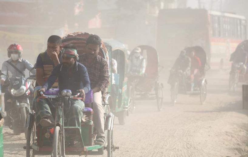 A student covering her face as dust pollution reaches an alarming stage in Dhaka. Photo: Mehedi Hasan